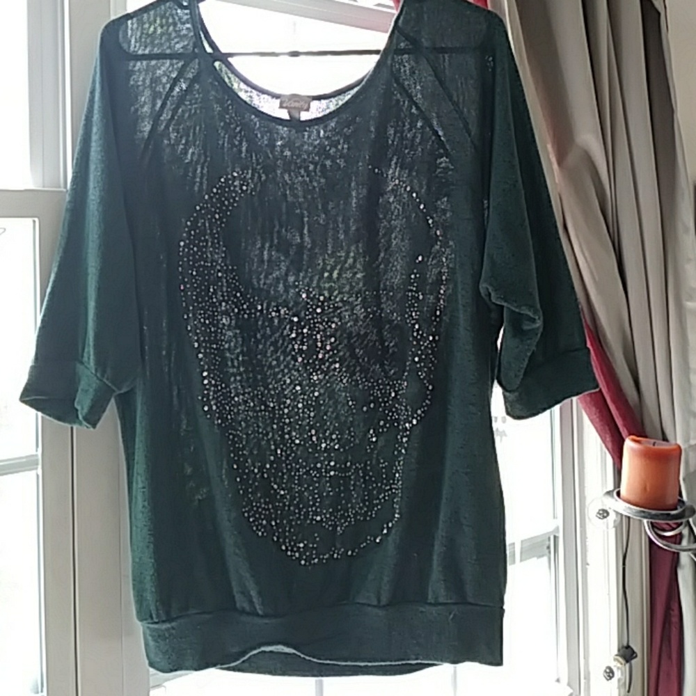 Green and black skull shirt.